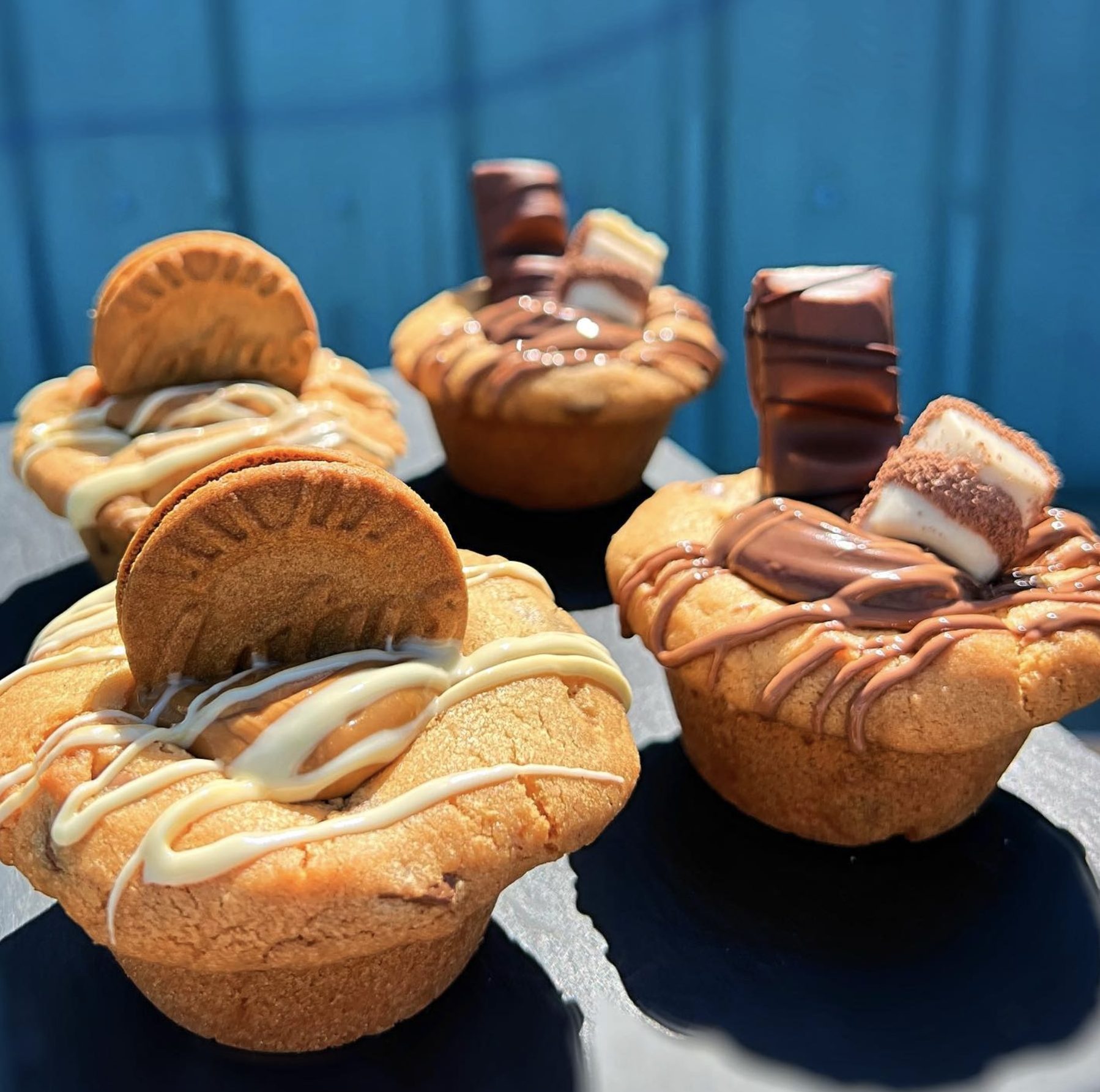 Lotus and Biscoff Cookie Cups drizzles with chocolate and biscuit topping outside in the sunshine at Longparke Farm 